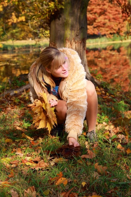 Young amateur and her boyfriend have sex on the ground during a Fall day 26733613